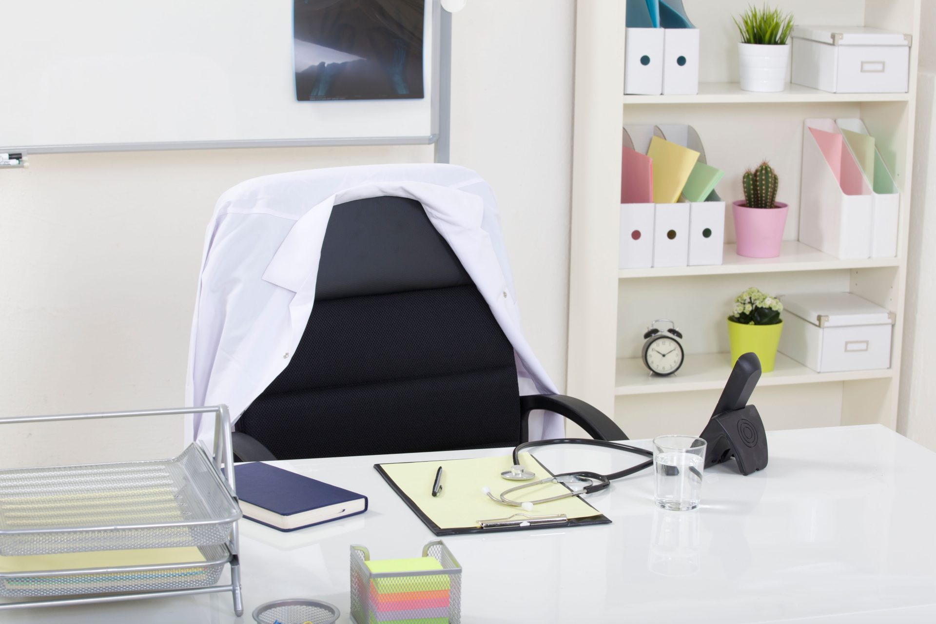 A clean and organized medical office featuring a stethoscope on a desk, symbolizing healthcare professionalism.